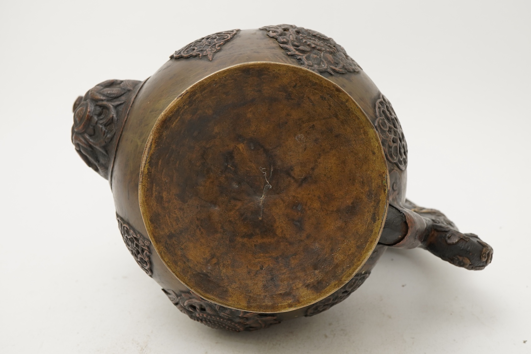 A large Tibetan repoussé brass and copper ewer, 19th century